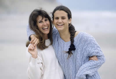 Mother and daughter embracing each other