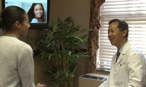 Dr. Adrian Lo in consultation