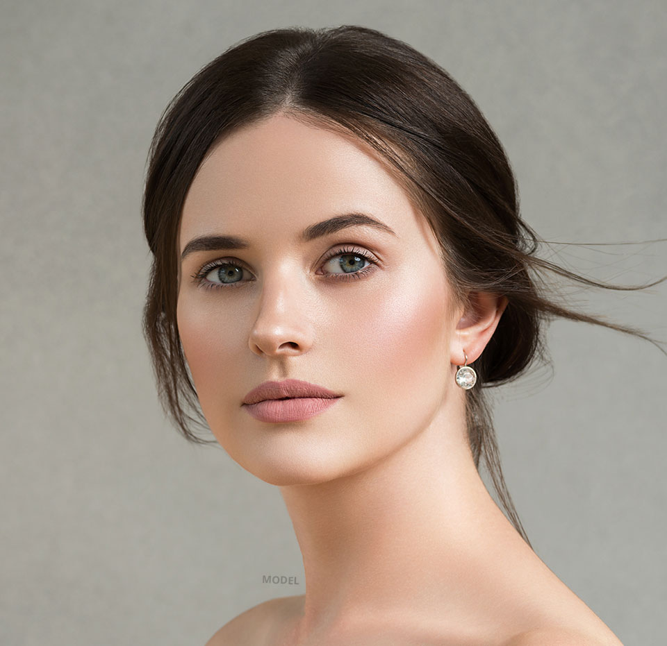 Headshot of a woman with smooth and beautiful facial features