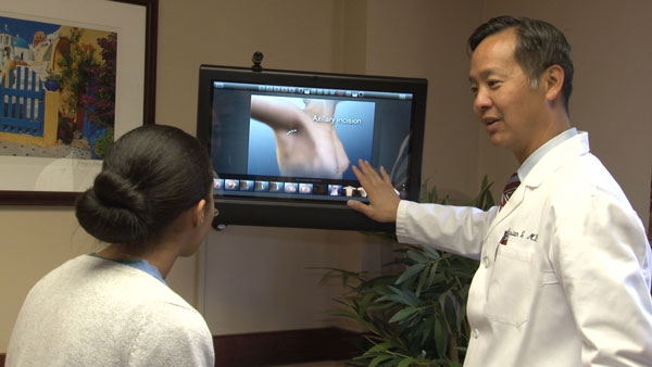 Dr. Lo with a patient