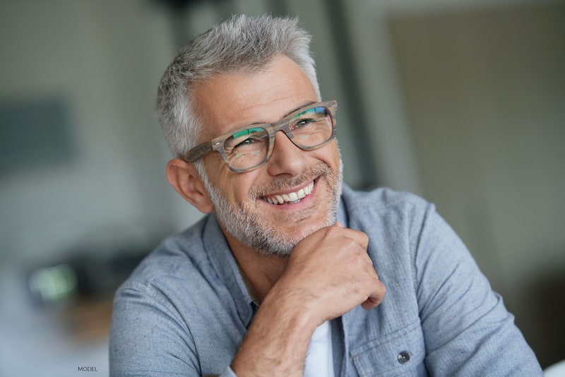 Attractive, gray-haired man smiling