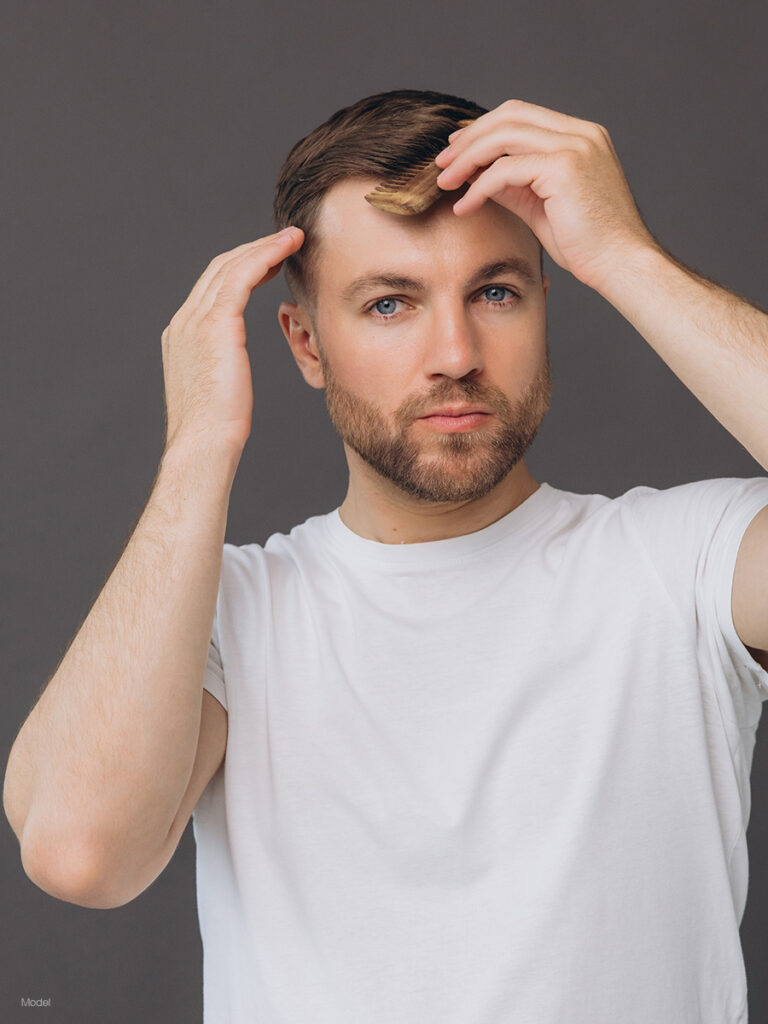 Man combing his hair