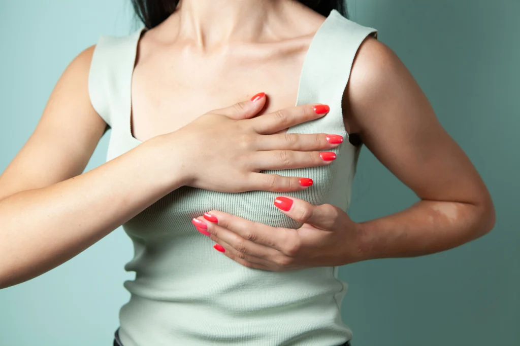 Image of a woman checking breast implants for comfort and natural feel