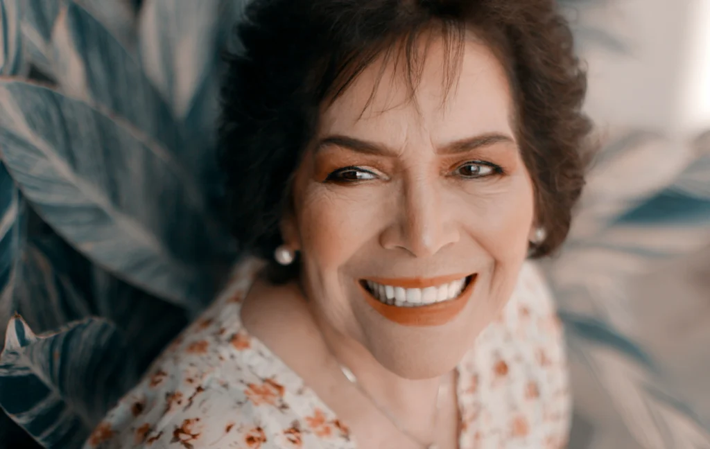 Image of an older women smiling with teeth scaled