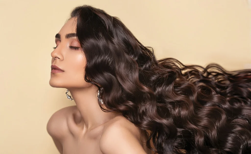 image of woman with long healthy hair and smooth waves in beauty portrait