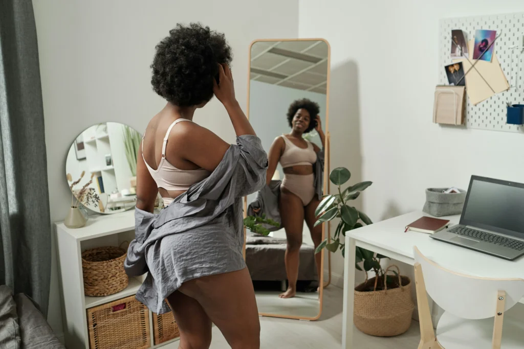 Image of woman reviewing her body confidence before breast augmentation in Philadelphia