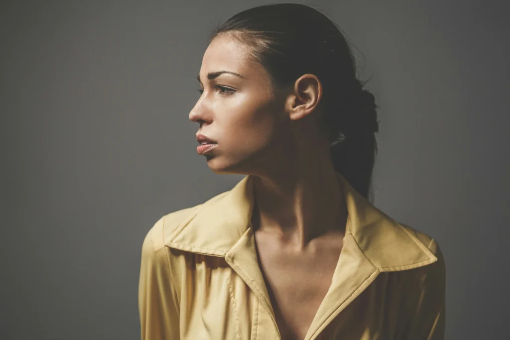 Image of woman with hair up showing natural ear profile in side view