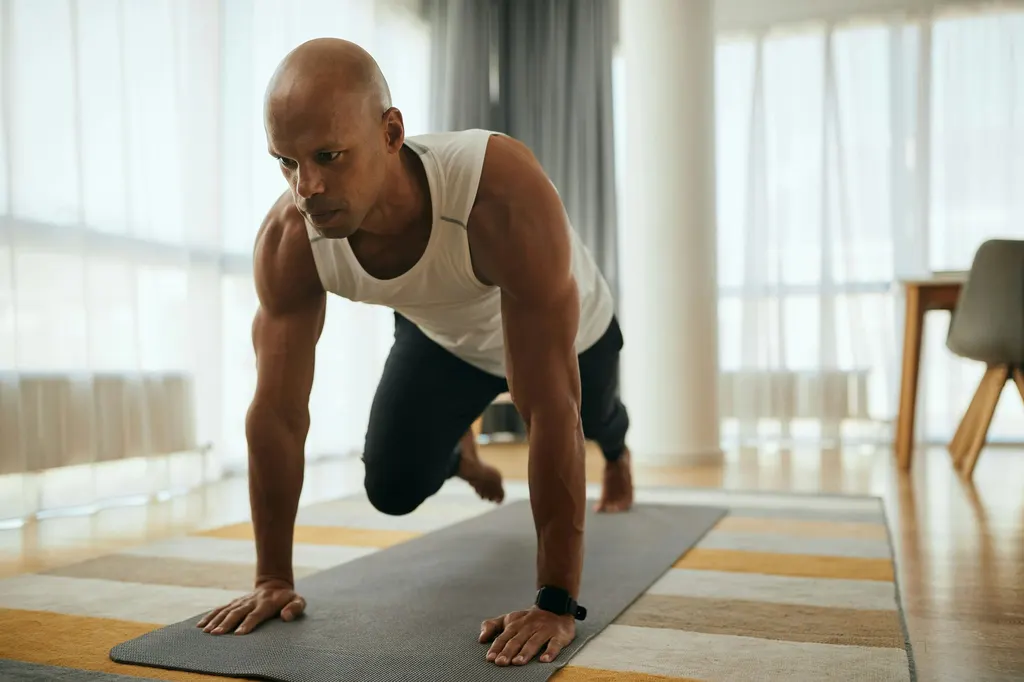 Man doing a light workout on a yoga mat during hair transplant recovery